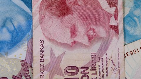 Monogram revolutionary statesman, founding father and first president Mustafa Kemal Ataturk on red 10 lira banknote. TRY paper bill, turkish money