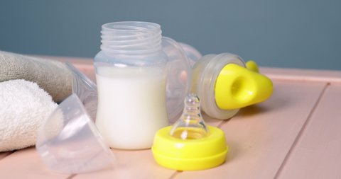 Breast pump and baby accessories on table