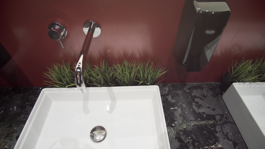Modern public toilet lavatory sinks.