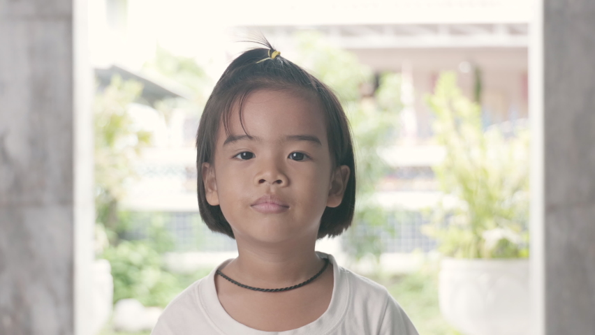 portrait of cute asian girl is smiling.