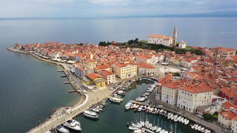 Aerial footage of the famous medieval Piran old town by the Adriatic sea in Slovenia. 
