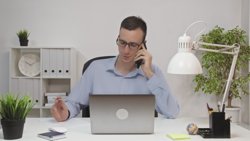 Phone Talk, Man Attending Call at Work | Shutterstock HD Video #1065604033