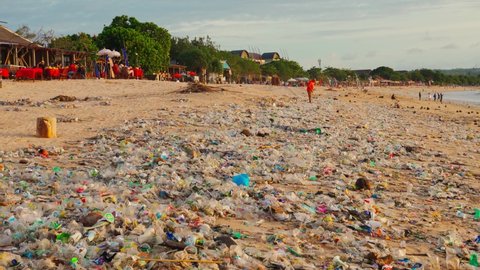 Bali, Jimbaran-Indonesia - Jan 5 2021: Beach Bali littered plastic waste. Indonesia is one of the world leaders plastic waste: annually 200 thousand tons plastic are dumped into rivers and ocean