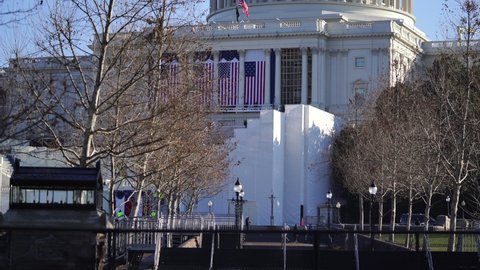 Washington, DC, USA - January, 12, 2021: US Capitol Building protected by nonscalable fence through Biden's inauguration during construction.