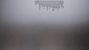 Draws a question mark on the window with your finger. The window was fogged up. Drawing on the wet glass of a window on a gloomy day, isolated at home. Gray colors - Powered by Shutterstock - Get 15% off with code: PIKWIZARD15