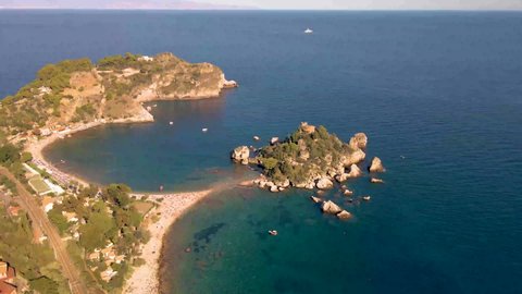Taormina Sicily Isola Bella beach from the sky aerial view voer the Island and the beach by Taormina Sicily Italy. Europe