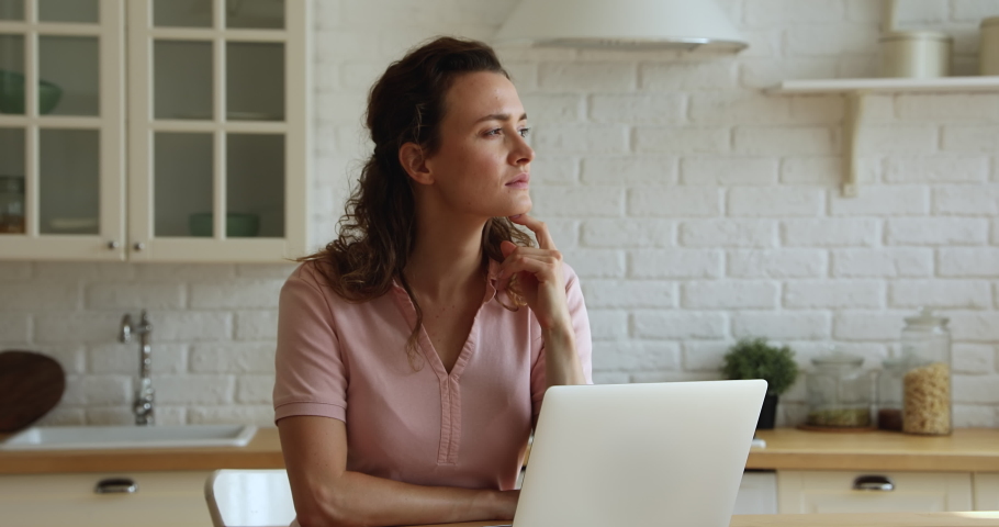 Serious pensive deep in thoughts female working on laptop, thinking over creative telework task, businesswoman solve issues remotely from home, considering, search ideas, inspiration, solution concept Royalty-Free Stock Footage #1065652900