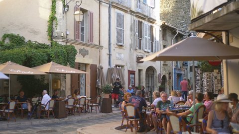 LOURMARIN, FRANCE - 3TH SEPTEMBRE 2019: Local people and tourists in the restaurant in the Lourmarin, Provence, France, Europe.

