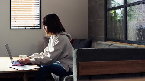 Japanese woman doing remote work at home

