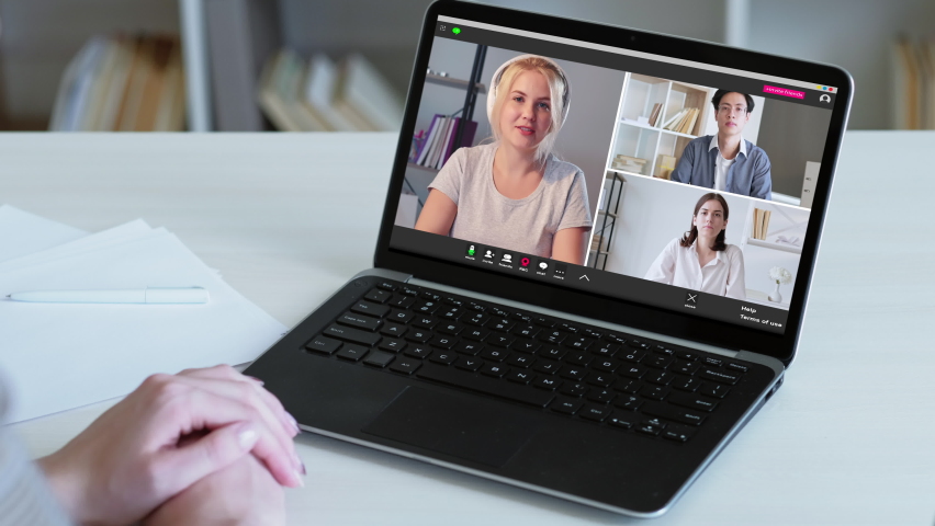 Video conference. Online meeting. Web communication. Remote job. Diverse corporate team working from home listening enthusiastic female colleague speaking on laptop screen at virtual office. | Shutterstock HD Video #1065675220