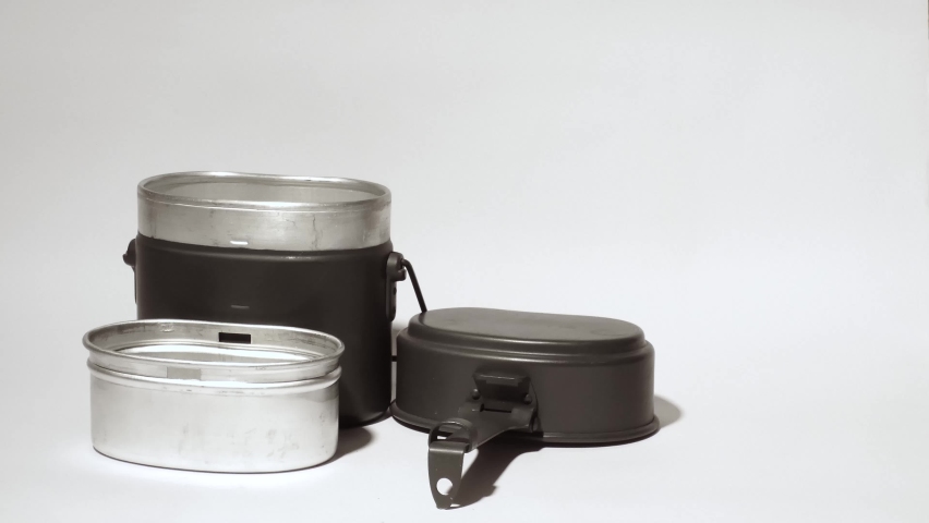 Grey army billycan. Dixy pot. Military mess kit  | Shutterstock HD Video #1065681658