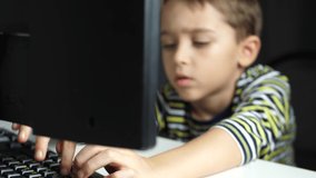 The child is remotely trained with the help of a computer. Distance learning. Remote work. Video call. Coronavirus concept.