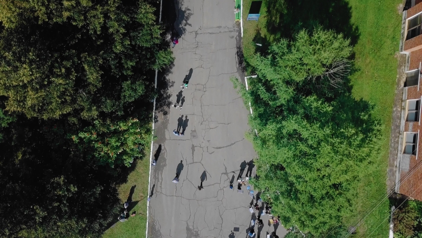 Aerial photography of people in a recreation park. People have fun on the rides.
