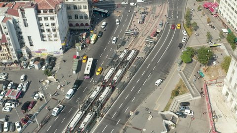 Tram Train arriving in public transport station in Istanbul, Aerial tilt up revealing City Buildings, Istanbul, Turkey on September 17th 2020