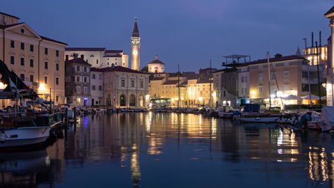 Night to day hyper lapse marina and old town Piran, Slovenia.