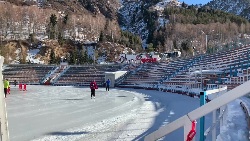 Background day ice skating on rink