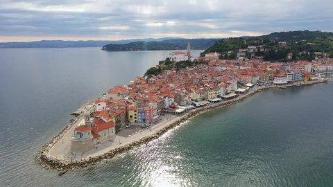 Aerial footage of the famous medieval Piran old town by the Adriatic sea in Slovenia. 