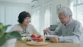 Attractive young senior asian citizen couple happy sit and talk, eat soup for healthy nutrition breakfast meal on dining table at home in morning in routine lifestyle in old asian people concept. - Powered by Shutterstock - Get 15% off with code: PIKWIZARD15