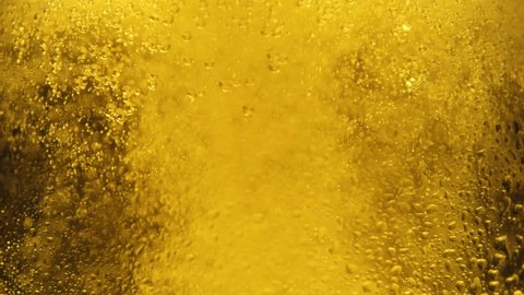 Beer background. Cold Light Beer in a glass with water drops.