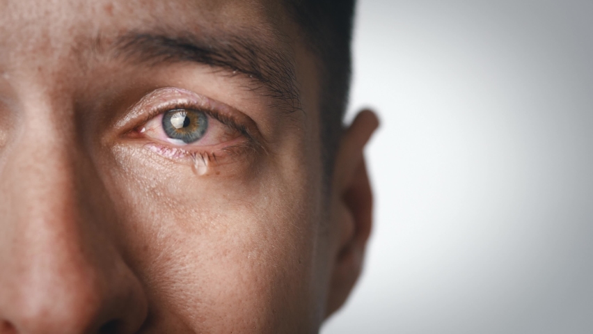 Closeup crying sad man with tears in eye. Depressed male in despair cry sorrow. Teardrop on his face. Drama, melodrama concept. | Shutterstock HD Video #1065745642