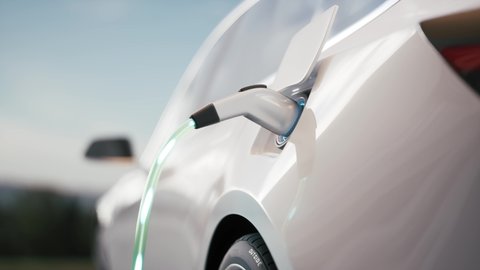 Electric car charging. Electric vehicle charging port plugging in car