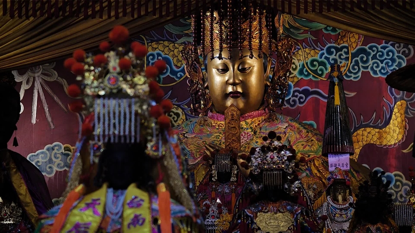 God sculpture at Kaohsiung Temple, Taiwan. Mid angle, parallax movement, slow motion, HD.