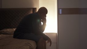 Depressed lonely old elderly black man. African American people sitting on bed in bedroom at home. Lifestyle on late night. Insomnia. Quarantine - Powered by Shutterstock - Get 15% off with code: PIKWIZARD15