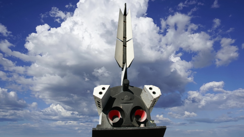 The Buran spacecraft -- Soviet orbital vehicle, against the moving clouds  