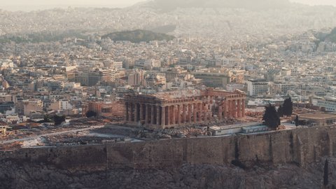 Establishing Aerial View Shot of Athens, Parthenon, sun kissed Acropolis, Greece.