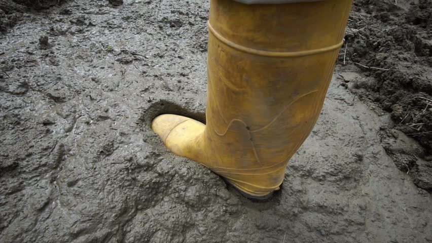 rubber boots in deep mud