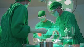 Professional medical team performing surgical operation in modern operating room. The doctor using VR glass helping to analysis COVID-19. The graphic pop up from the high medical technology glasses. - Powered by Shutterstock - Get 15% off with code: PIKWIZARD15