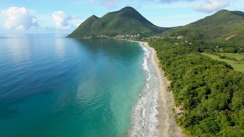 Scenic beach on Caribbean island for summer holidays vacation, 4k aerial video footage from drone of Martinique, Antilles with beautiful blue sea water and sandy coastline