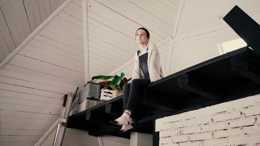 Young Woman Staying at Beautiful Geodesic Dome Inside. Lady Living in Tiny House and Being Happy About New Place to Stay. Modern House, Youth and Creativity Concept.