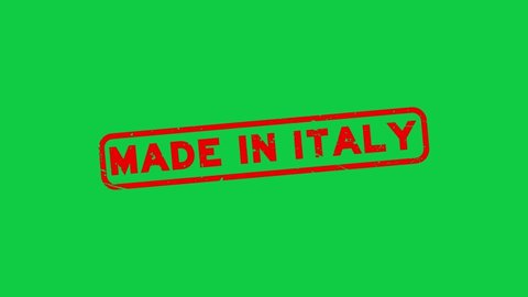 Grunge red made in Italy word rubber seal stamp zoom on green background