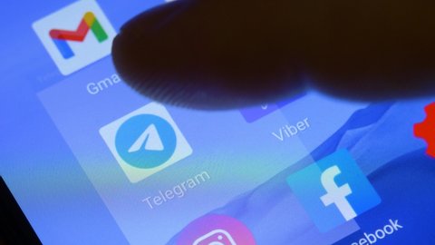 KHARKIV, UKRAINE - JANUARY 15, 2021: Telegram application on screen of smartphone. Messenger app icon. Social media and network