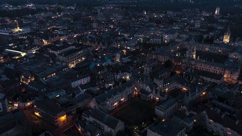 Establishing Aerial View Shot of Oxford UK, city center and old town, United Kingdom at night evening