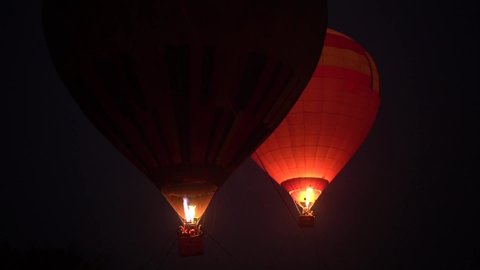 Hot air balloon festival, Night light show Ukraine, slow motion. Kiev December 18, 2020 