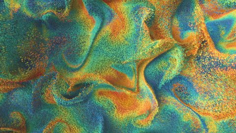 VJ Seamless loop. 4K. An abstract composition of saturated particles swirling in a powerful vortex. Cyan, yellow, green, blue and orange are mixed in a stream of tiny grains of sand. Citrus colors. Video Stok