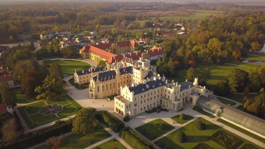 Aerial view of small town Lednice and castle yard with green gardens in Moravia, Czech Republic. UNESCO World Heritage Site. Royalty-Free Stock Footage #1065845920