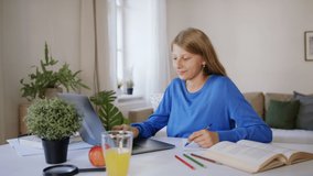Schoolgirl learning online indoors at home, coronavirus concept.