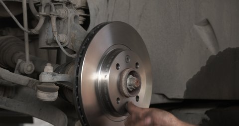 Car Brake Disk Replacement In Car Repair Shop.