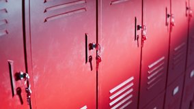 Seamless looping animation of red lockers for students at school or university. An endless row of lockers at college hallway or gym. Safety place for pupils' books or personal things. Close up. - Powered by Shutterstock - Get 15% off with code: PIKWIZARD15