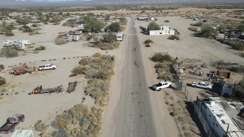 aerial view of Slab City, an unincorporated, off-the-grid squatter community consisting largely of snowbirds in the Salton Trough area of the Sonoran Desert, California, USA. January 16th, 2020 Royalty-Free Stock Footage #1065850087