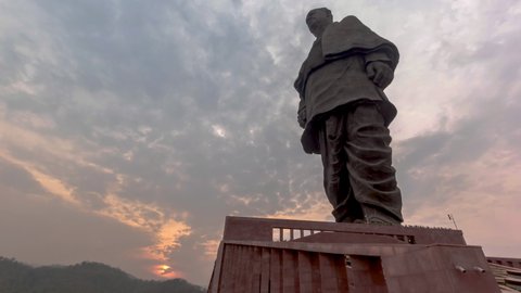 Narmada Dam, Gujarat  India - December 4th 2018 : Beautiful Sunset Time Lapse and Clouds Moving over the Statue of Unity Sardar Vallabhbhai Patel, the world's tallest statue