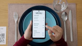 Hand's customer scan QR code for online menu service at table in restaurant during pandemic coronavirus. New normal contactless technology lifestyle protection coronavirus pandemic in restaurant - Powered by Shutterstock - Get 15% off with code: PIKWIZARD15