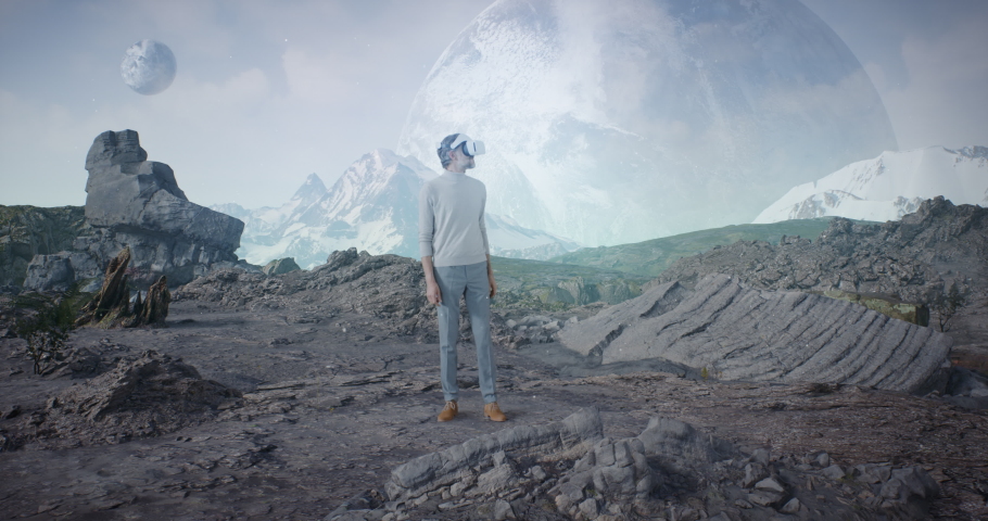 Zoom out view of middle aged male in casual clothes putting on VR helmet and examining extraterrestrial landscape at home Royalty-Free Stock Footage #1065867184