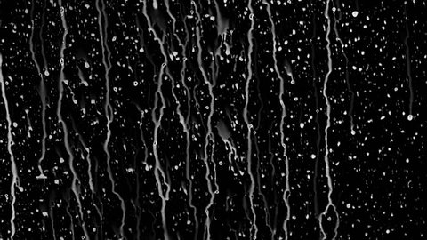 A lot of raindrops of white water falling down on glass. Perfect for digital composing. Pure black background.