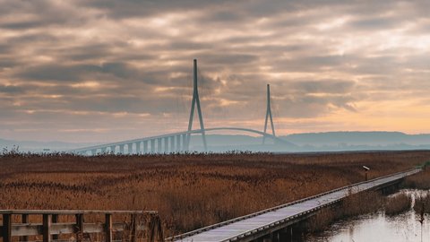 2021-01--20_4K Timelapse Sequence of Pont de Normandie, France - The Pont de Normandie cable-stayed road bridge that spans the river Seine linking Le Havre to Honfleur in Normandy