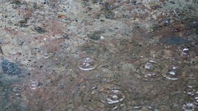 4K Video : Rainfall on concrete road. Torrential rain refers to the heavy downpour of rain. 