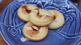 Footage of piercing homemade baked donut with a fork. Easy dessert recipes to make at home while social distancing in the COVID-19 outbreak. 